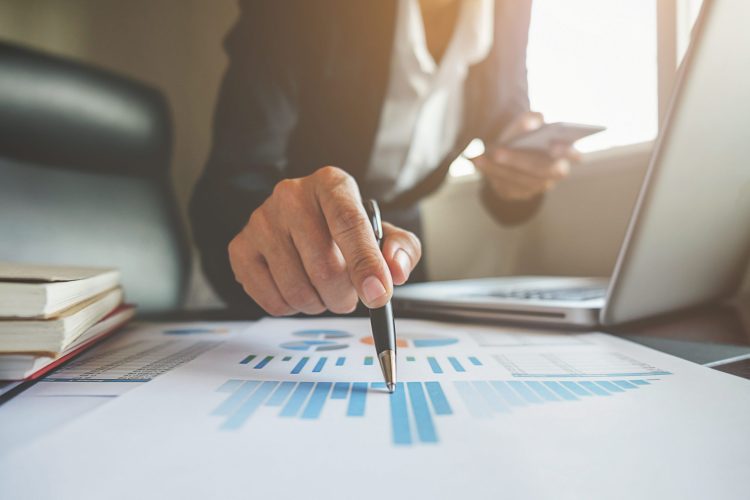 financial-consulting-manager-accountant-professional-discussion Business concept. Business people discussing the charts and graphs showing the results of their successful teamwork.